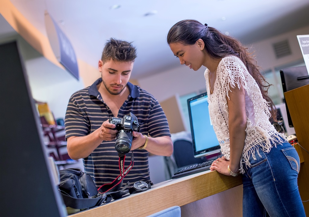 two students using a camera