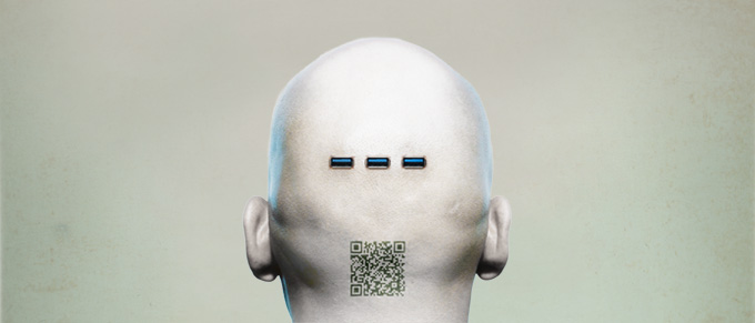 bald human head with a green cast has a QR code at the base of head and three usb slots a few inches above