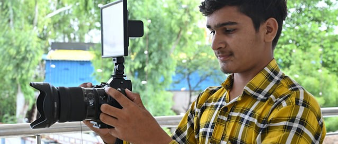 person holding video camera