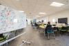 Science Library 5th floor collaboration zone with tables and chairs